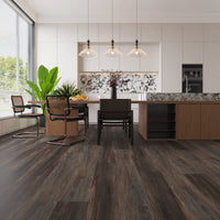 Modern kitchen with wooden flooring, dining table, and kitchen island.
