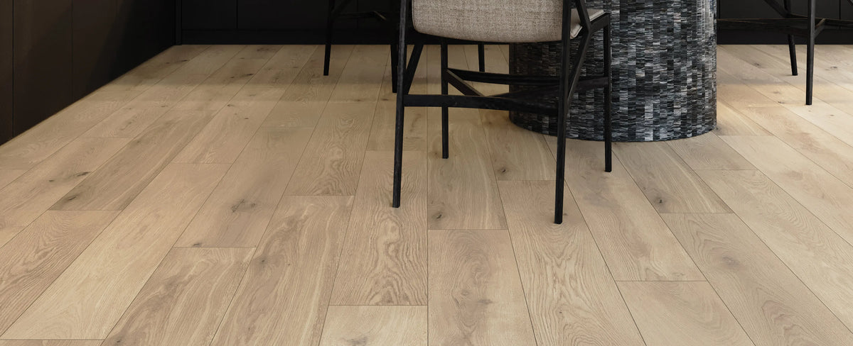 Wooden flooring with a chair and decorative item in the background