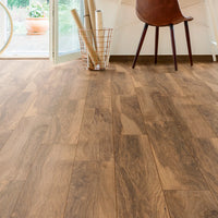 Wooden flooring in a room with furniture and decor