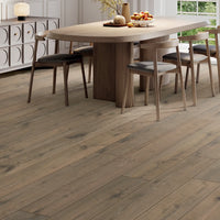 Wooden flooring with a dining area in the background