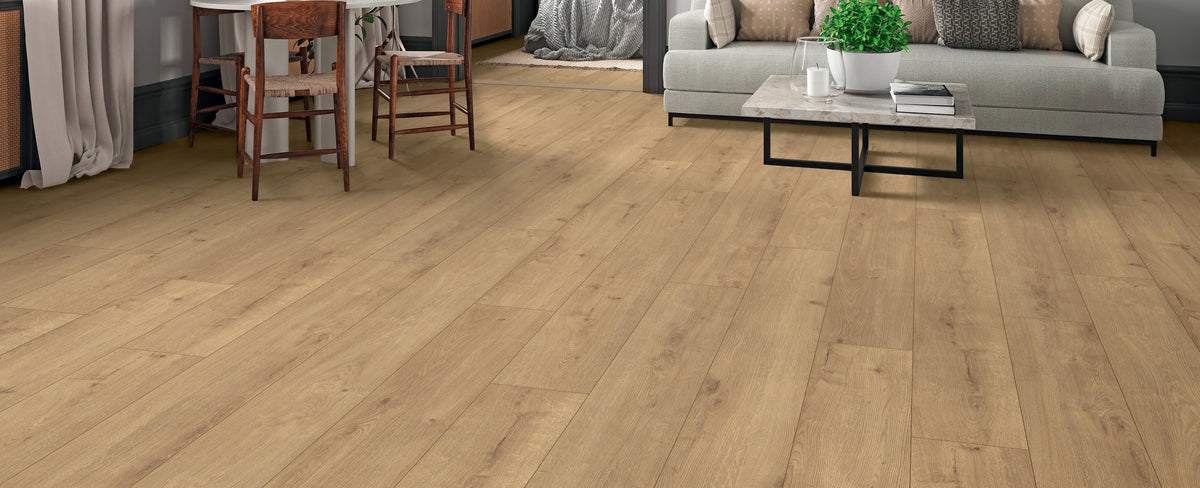 Wooden flooring in a living room setting with furniture.