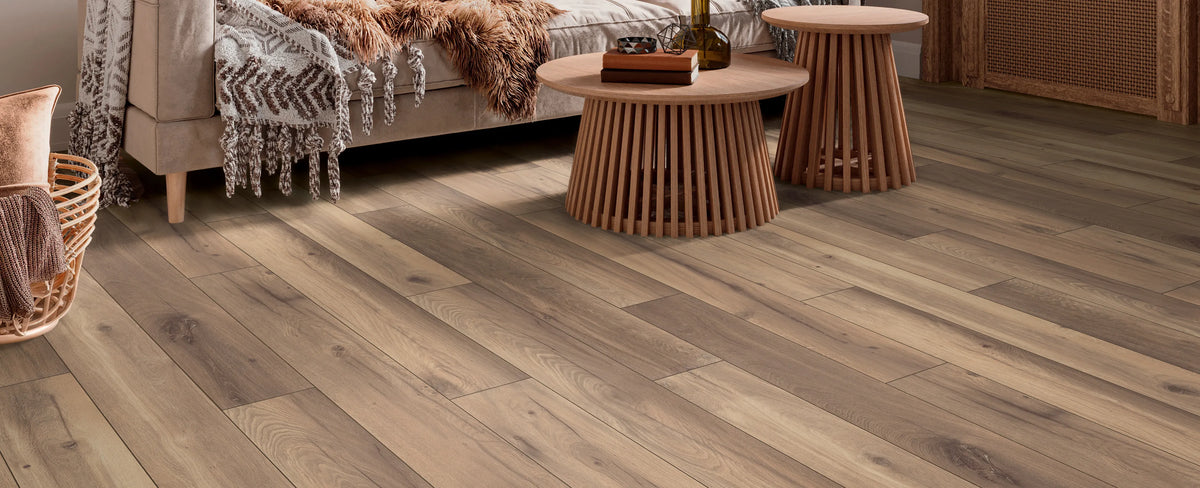 Wooden flooring with a living room setting in the background