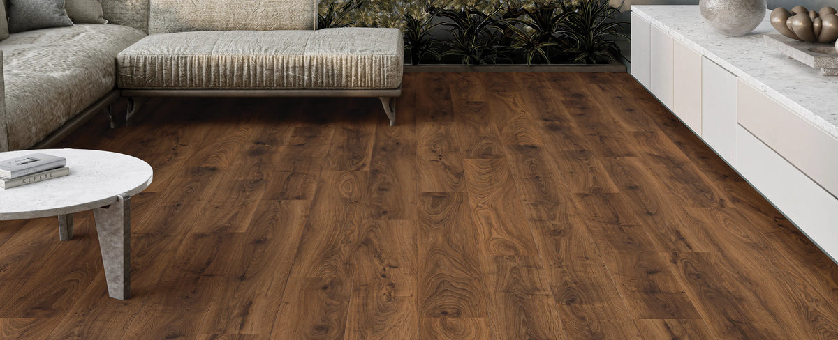 Wooden flooring in a living room setting with a sofa and coffee table.