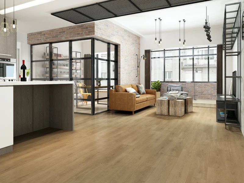 Modern open-plan living space with kitchen, living room, and office area.