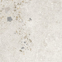 Textured concrete surface with small stones and pebbles