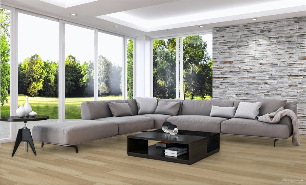 Modern living room with a gray sectional sofa, coffee table, and large windows.