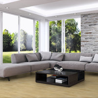 Modern living room with a large sectional sofa, coffee table, and decorative items.