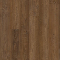 Close-up of a wooden floor with a warm brown color and visible grain pattern.